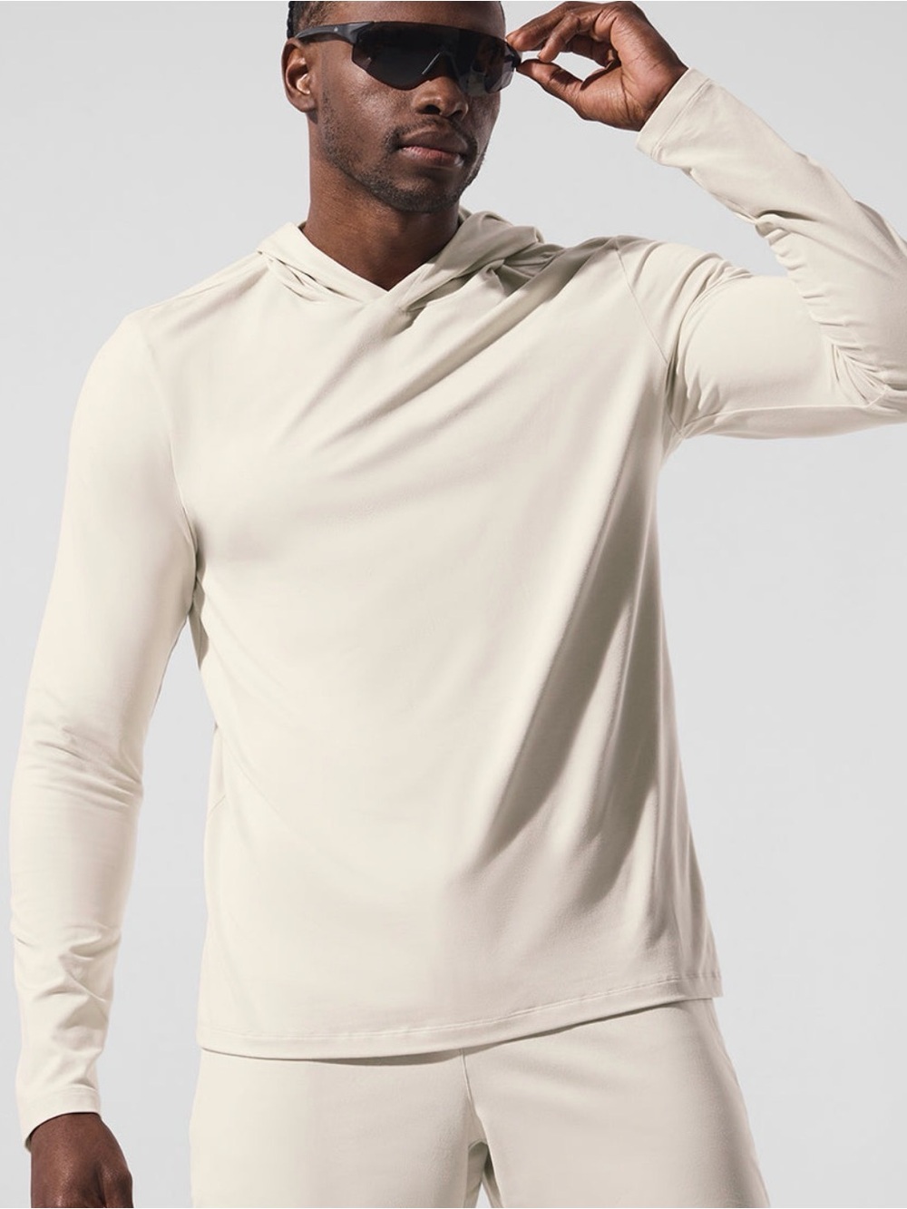 ALO Yoga Conquer Reform long sleeve top with hood - Bone